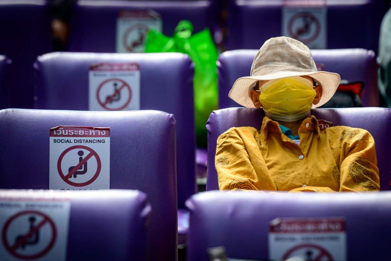 TOPSHOT - A passenger wearing a protective face mask waits for his train at Hua Lamphong Central Railway Station in Bangkok on January 4, 2021, as health officials in Thailand announced on Monday 745 new Covid-19 coronavirus cases, the country's highest daily figure since the start of the pandemic. (Photo by Mladen ANTONOV / AFP) (Photo by MLADEN ANTONOV/AFP via Getty Images)